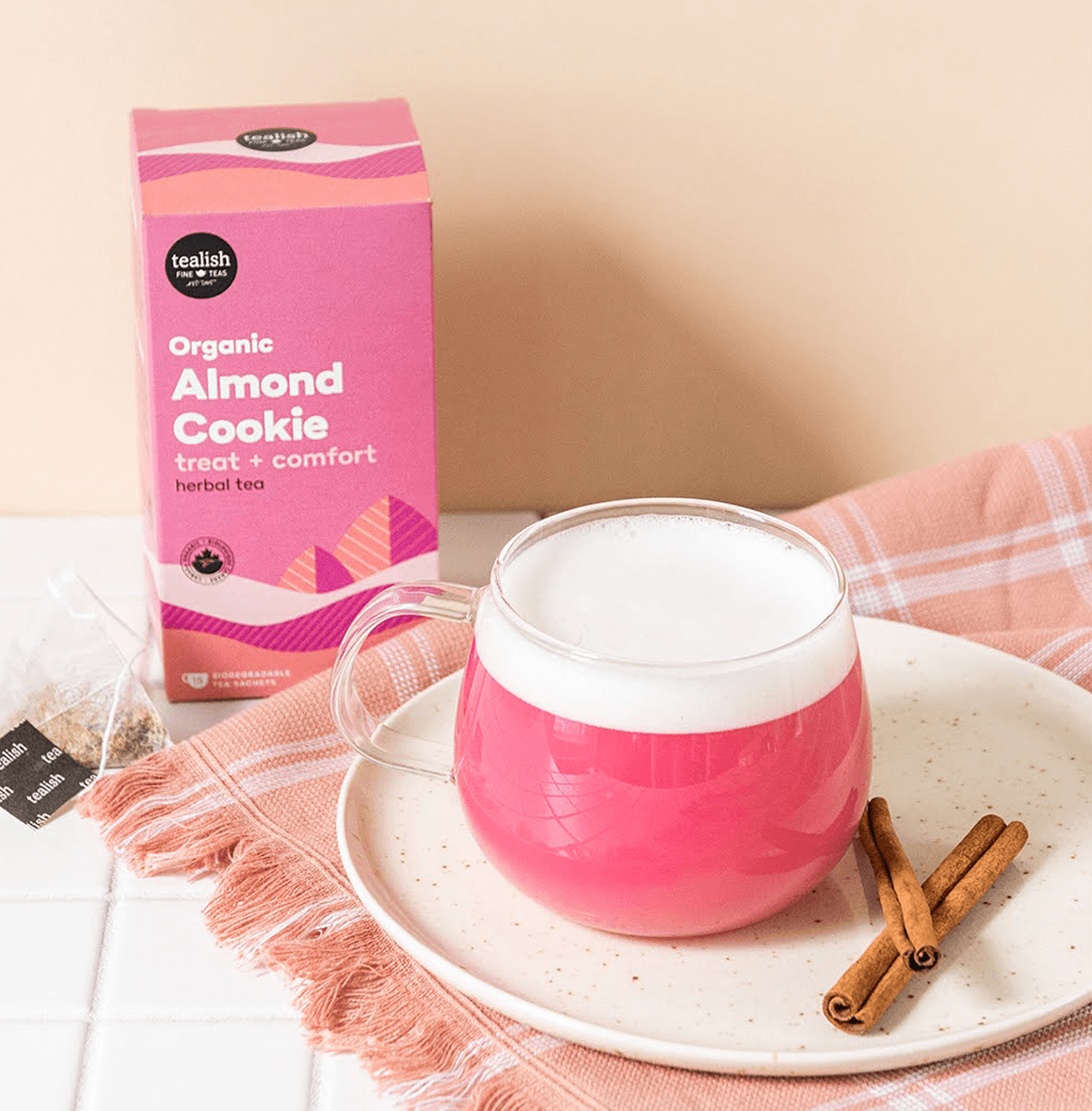 Organic Almond Cookie tea with apple, almond, and cinnamon—sweet, smooth, and comforting with a pink hue; perfect as a cozy cup or a creamy latte treat.