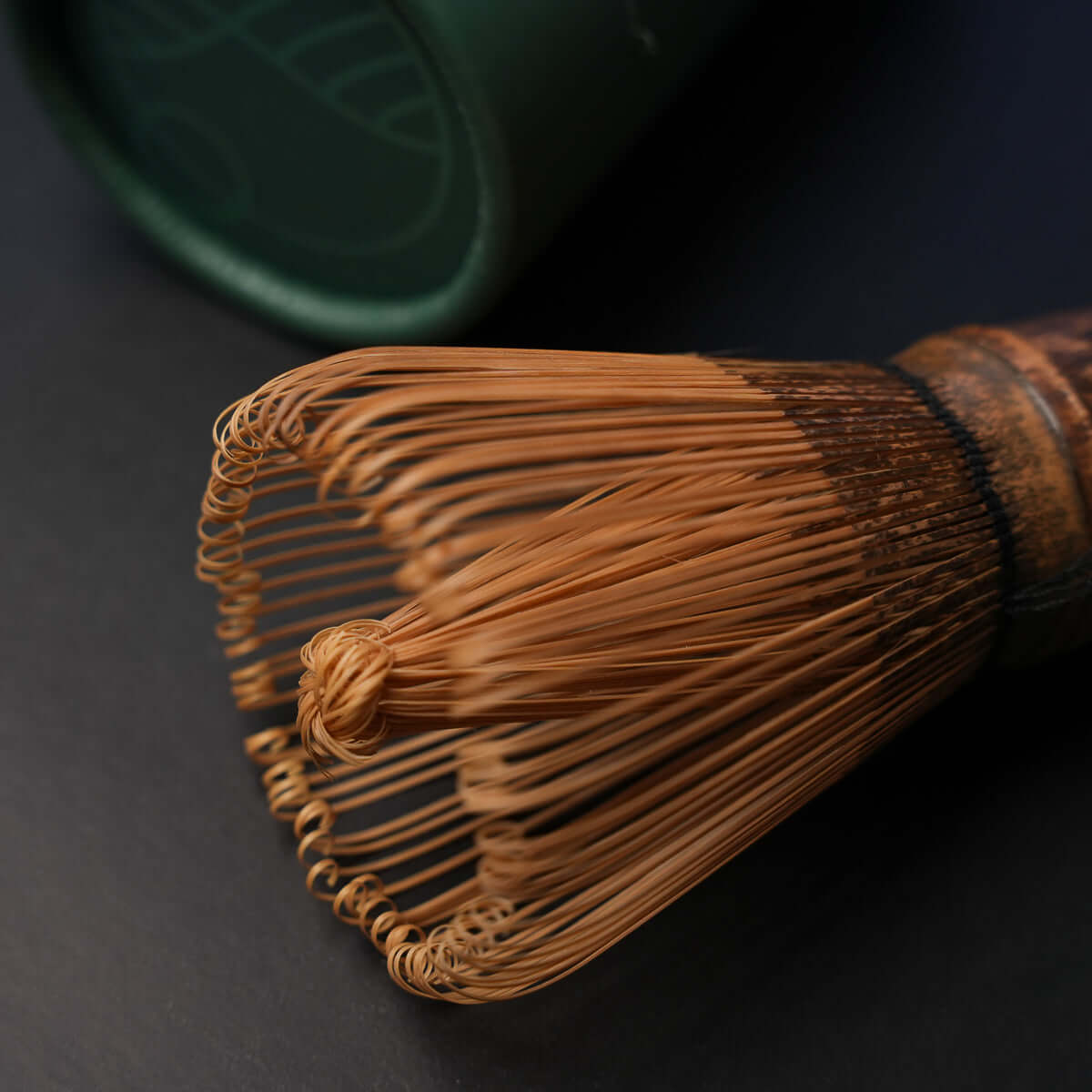 Handmade purple bamboo Matcha whisk with 80 prongs, perfect for thick and thin Matcha tea. Includes travel/storage sleeve.