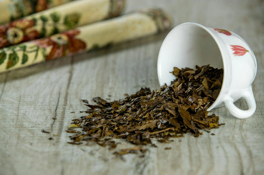 What is Hojicha? The Japanese Roasted Tea Taking Dubai by Storm - spilled hojicha tea leaves from a white cup