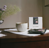 La Cabra Rwanda Shyira specialty coffee single-serve brew bags with coffee cup and box on a table