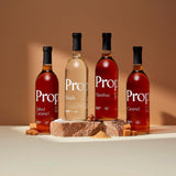 Vanilla Syrup and other flavored syrups displayed on a neutral background, showcasing quality natural ingredients.