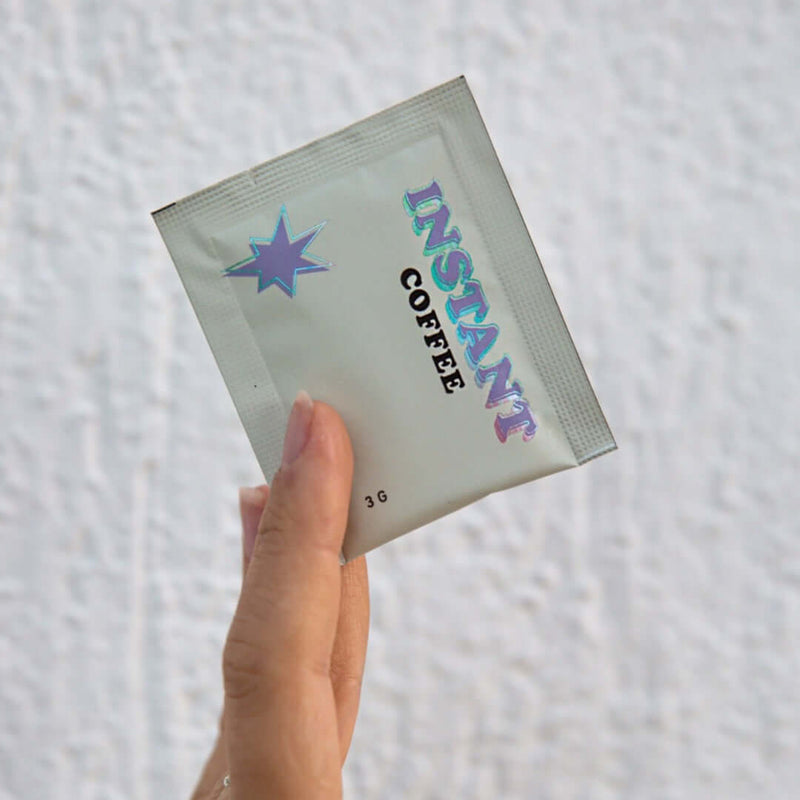 Instant Coffee by Three Coffee in sleek box of 7 sachets, freeze-dried blend with Timor-Leste and Ethiopia origins, crafted for café-quality brews without gear or effort.