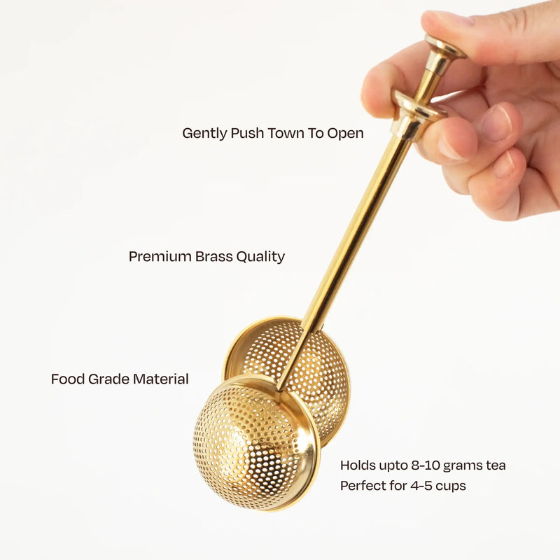 Elegant gold modern fine mesh tea infuser for precise and flavorful loose-leaf tea brewing.