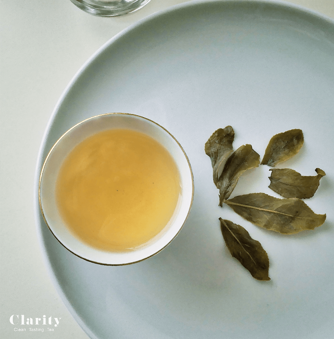Clarity Silk Dancer Milk Oolong tea with smooth, floral, and milky notes, crafted in Taiwan from the Golden Lily cultivar by an award-winning tea master.