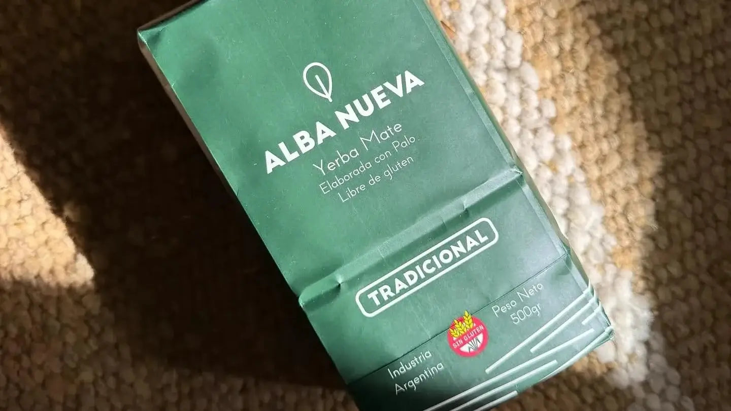 Green package of Alba Nueva yerba mate on a textured surface