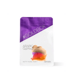 Bag of Arabic Gahwa Specialty Ground Coffee with purple and white design, highlighting nutty and sweet flavor profile.