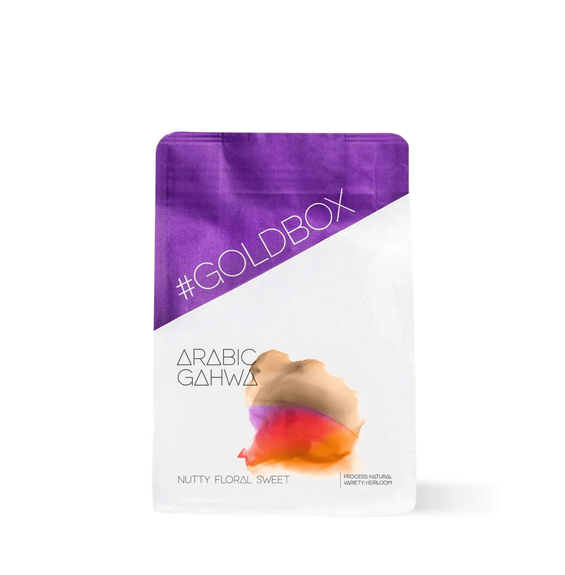 Bag of Arabic Gahwa Specialty Ground Coffee with purple and white design, highlighting nutty and sweet flavor profile.