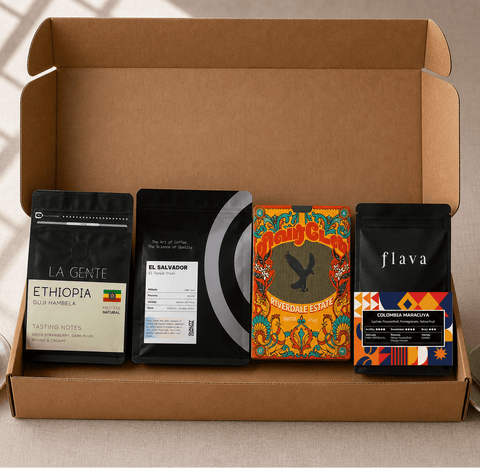 Open cardboard box containing coffee packages with visible branding and labels.