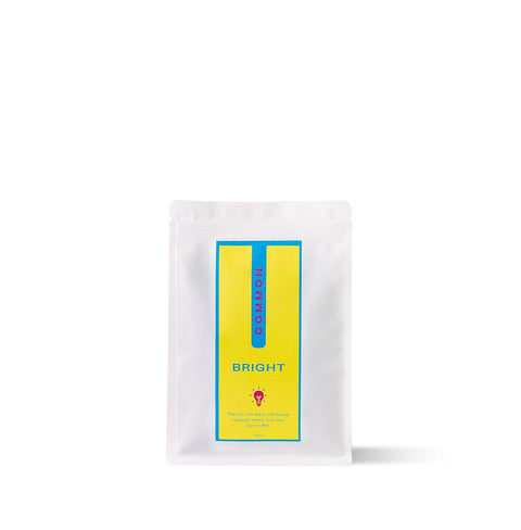 Bright Rwandan coffee pack by COMMON with notes of redcurrant, juicy peach, and honey.