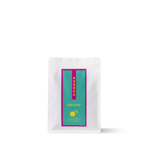 COMMON Decaf Brazilian coffee pack with apple, dark chocolate, and biscuit flavor notes.