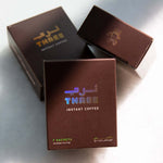 Instant Coffee by Three Coffee in sleek box of 7 sachets, freeze-dried blend with Timor-Leste and Ethiopia origins, crafted for café-quality brews without gear or effort.