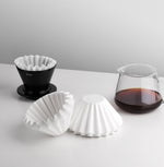 FLO 85 Paper Filters 100x with Varia FLO dripper and brewed coffee for optimal flavor.