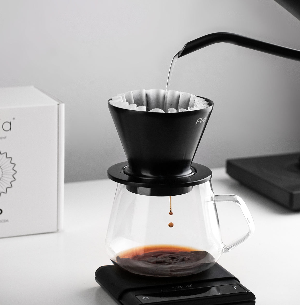 FLO 85 Paper Filters 100x used in a Varia FLO dripper for brewing coffee.