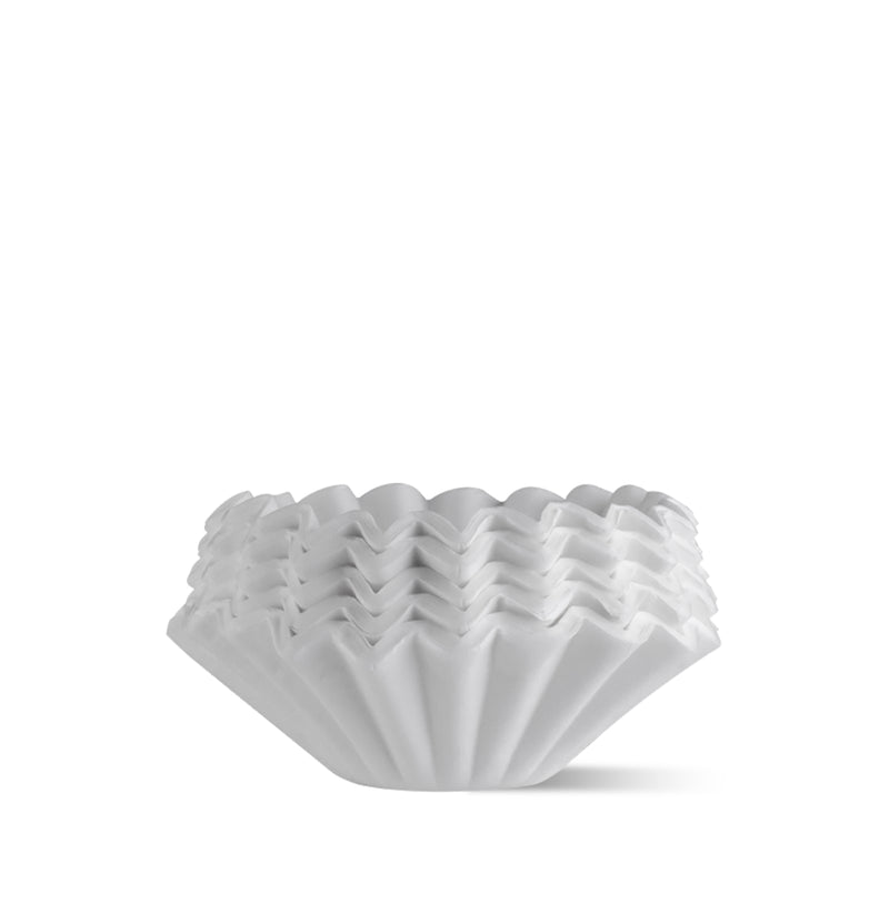 FLO 55 Paper Filters 100x stacked, designed for precise extraction in coffee brewing.