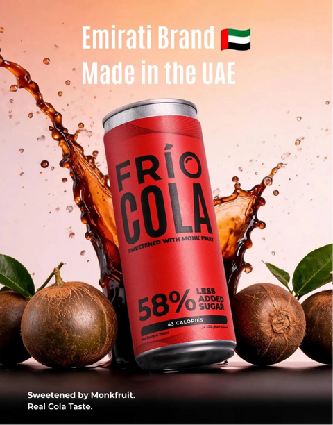 Four red Frío Cola canned beverages lined up side by side on a white background. The cans feature black text reading 'FRÍO COLA' and '58% LESS ALCOHOL SUGAR'.