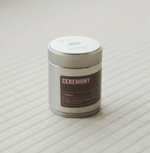 Hojicha tea in a silver tin, roasted Japanese green tea with nutty flavor, perfect for soothing drinks and desserts.