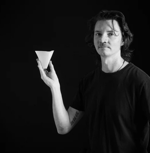 Person holding Sibarist B3 Hybrid Coffee Paper Filter in black and white image