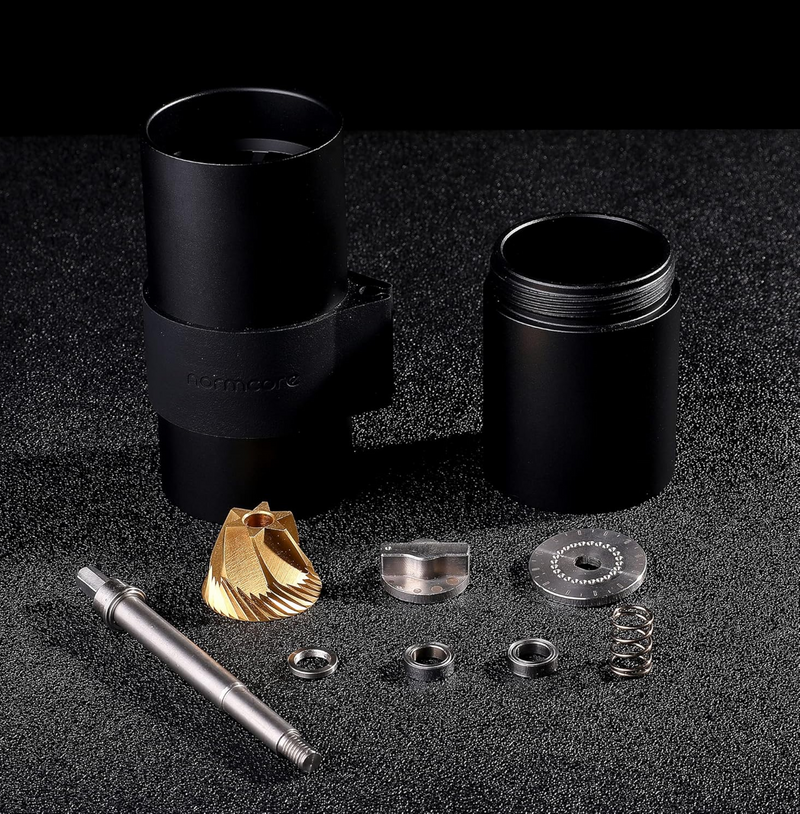 Exploded view of Normcore V2 Manual Coffee Grinder Titanium Plated showcasing parts and titanium-plated burrs for consistent grind.