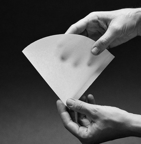 Person holding a Sibarist B3 Cone Coffee Filter for pour-over brewing