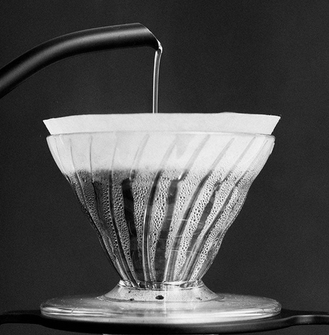 Sibarist Fast - Cone Specialty Coffee Paper Filter in a V60 dripper with water being poured