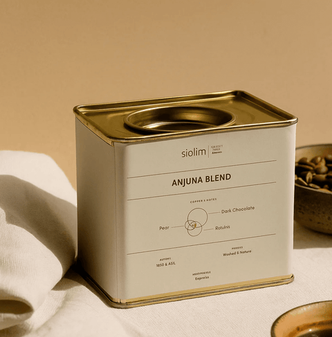Anjuna Blend coffee by Siolim in a stylish tin, showcasing medium dark roast for espresso with notes of chocolate, raisins, and pear.