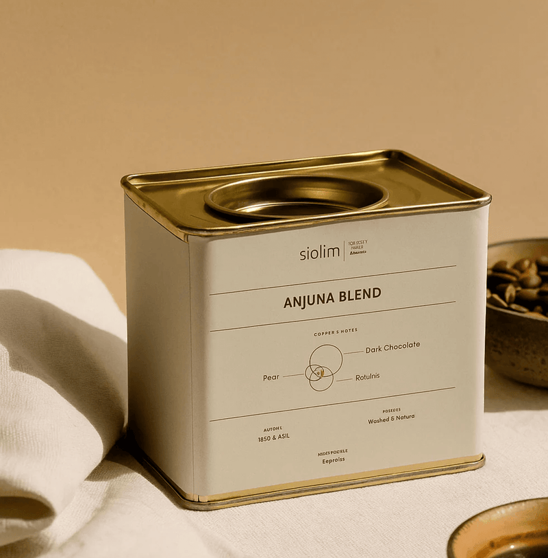 Anjuna Blend coffee by Siolim in a stylish tin, showcasing medium dark roast for espresso with notes of chocolate, raisins, and pear.