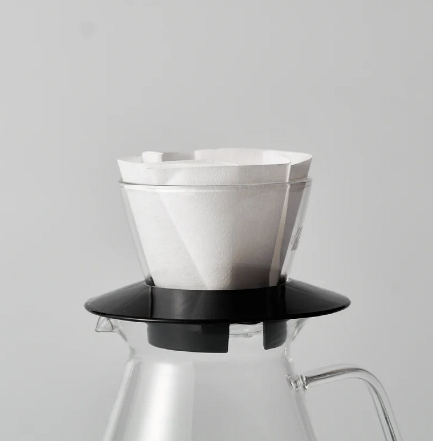 Sibarist B3 Flat Coffee Filter Paper in a pour-over setup on a glass carafe, enhancing coffee clarity and sweetness.