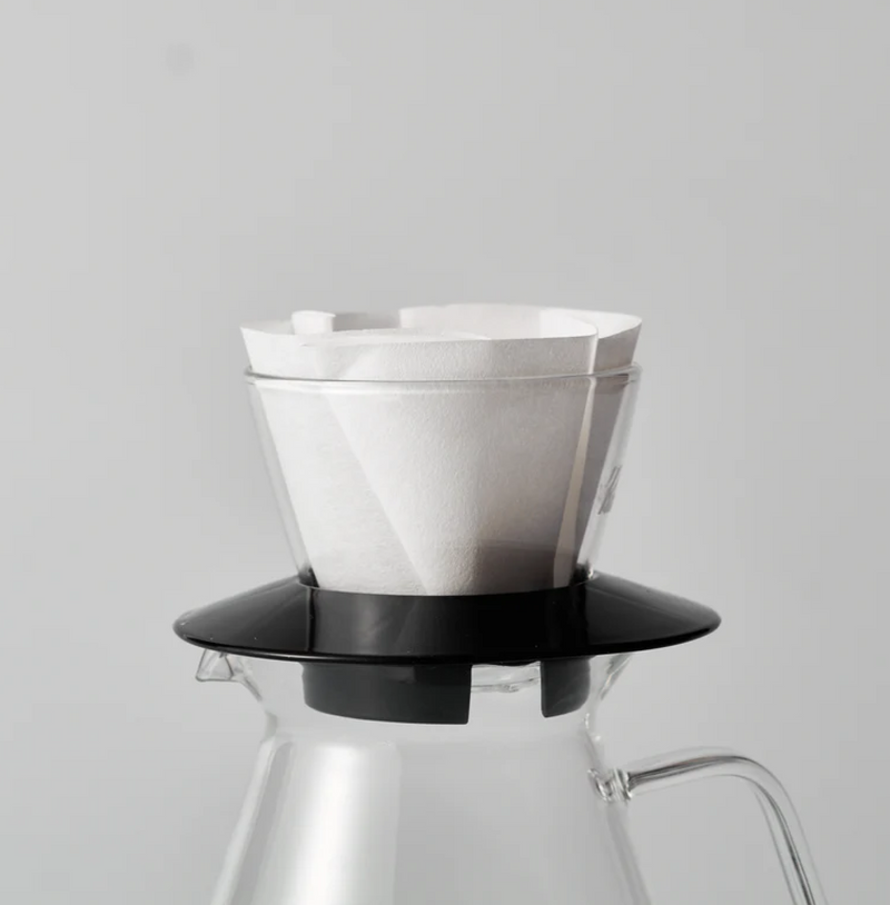 Sibarist B3 Flat Coffee Filter Paper in a pour-over setup on a glass carafe, enhancing coffee clarity and sweetness.