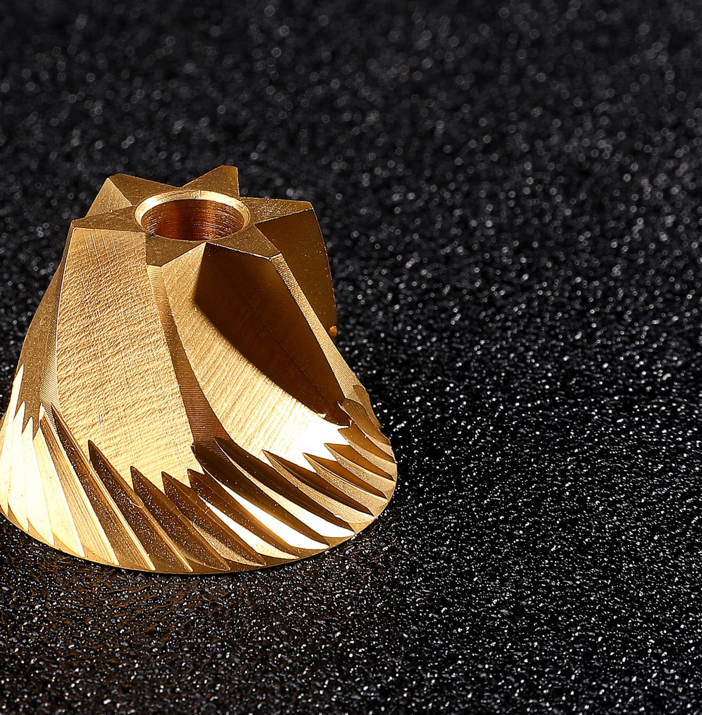 Titanium plated burr of Normcore V2 Manual Coffee Grinder showcasing precision engineering and design in a high-quality burr grinder.