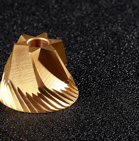 Titanium plated burr of Normcore V2 Manual Coffee Grinder showcasing precision engineering and design in a high-quality burr grinder.