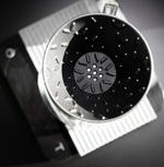 Graycano Coin placed at the base of a coffee dripper, showing optimized water flow and stainless steel construction.