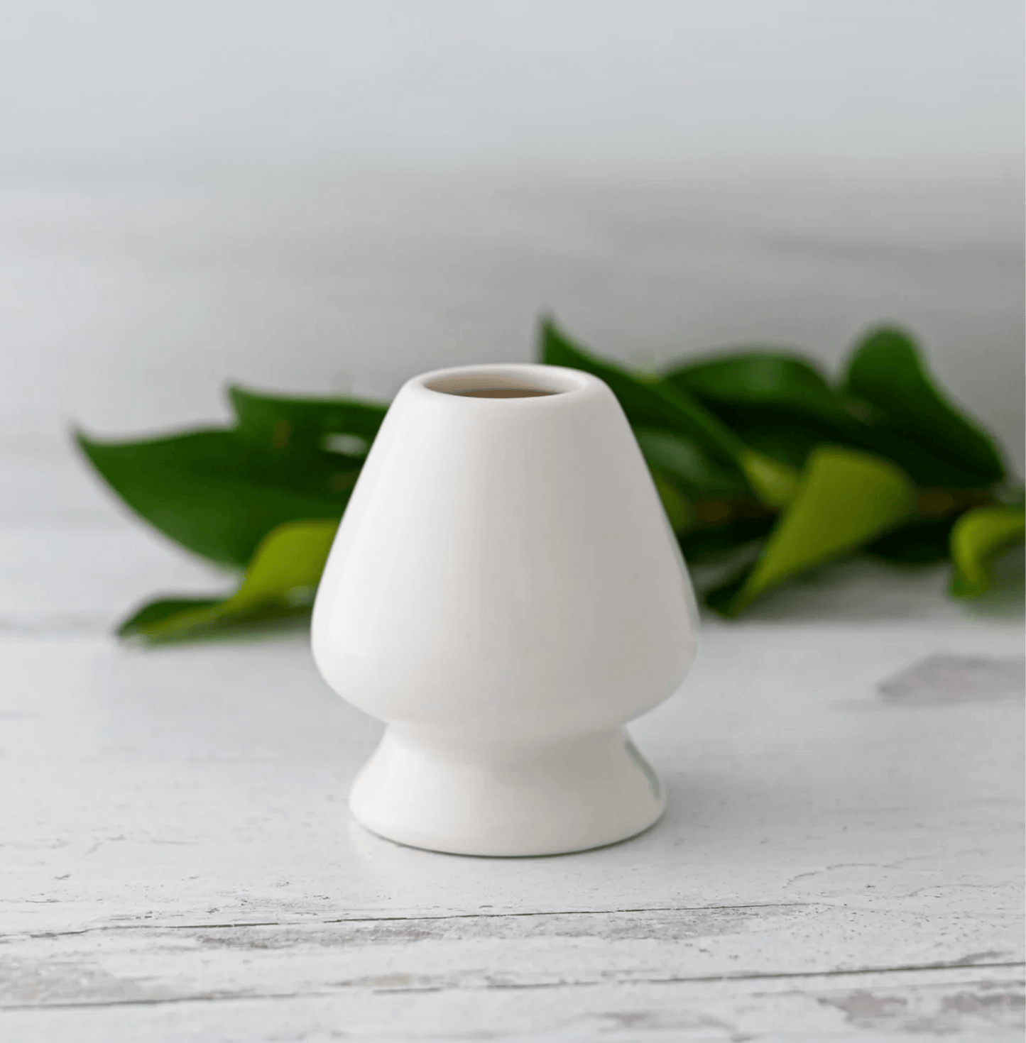White Whisk Holder in ceramic, designed for drying bamboo matcha whisk, with a smooth, curved body to maintain prong shape.