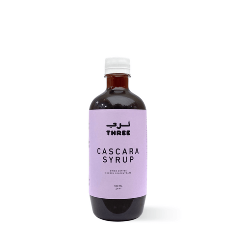 Bottle of organic Cascara Syrup ideal for summer drinks in UAE, made with purified water and cascara pods, on a plain background.