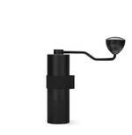 Normcore V2 Manual Coffee Grinder Titanium Plated with ergonomic silicone grip and sleek aluminum body.