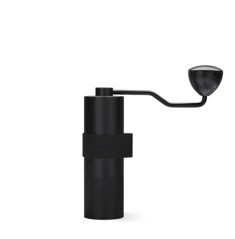 Normcore V2 Manual Coffee Grinder Titanium Plated with ergonomic silicone grip and sleek aluminum body.