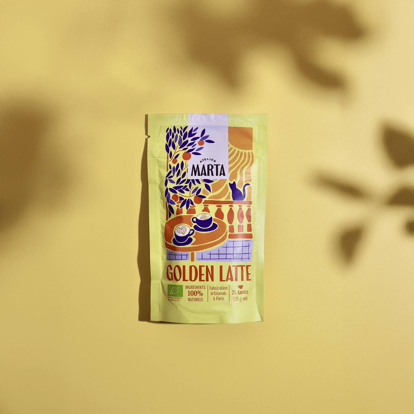 Organic Golden Latte packet from Atelier Marta featuring turmeric and spices on a yellow background.