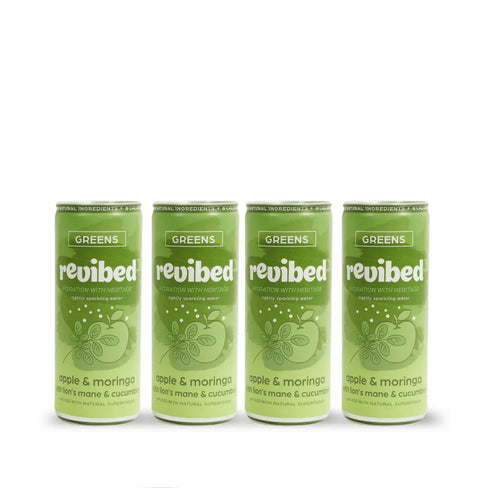 Four green cans of revibed Greens drink on a white background