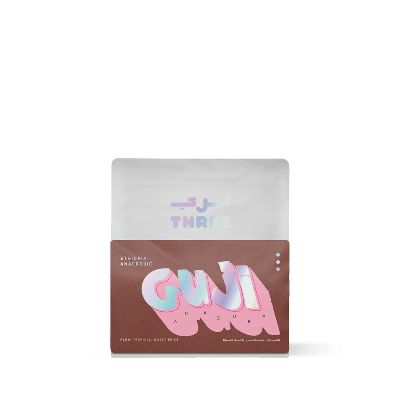 Ethiopia Guji Anasora by Three Coffee in vibrant specialty packaging, anaerobically fermented for bold strawberry and tropical flavors, grown at high altitude with a syrupy body and sparkling acidity.