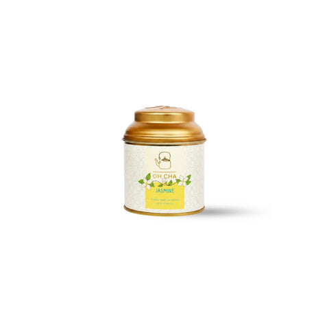 Premium OH CHA Jasmine loose leaf green tea with dried jasmine blossoms in decorative metal tea canister.