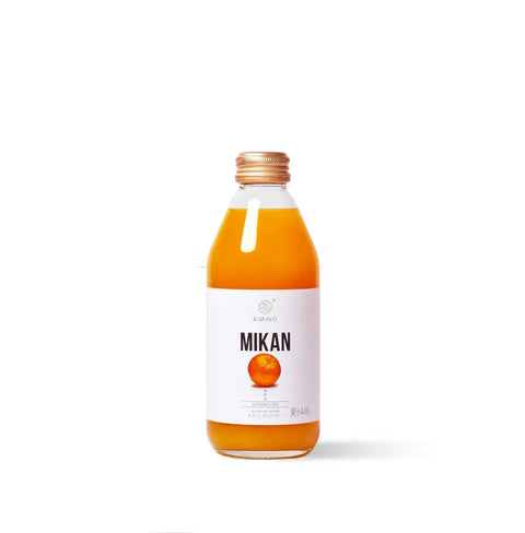 Bottle of Mikan Sparkling Juice with Yuzu, pure mountain water, and organic cane sugar, from Japan's Shikoku orchards.