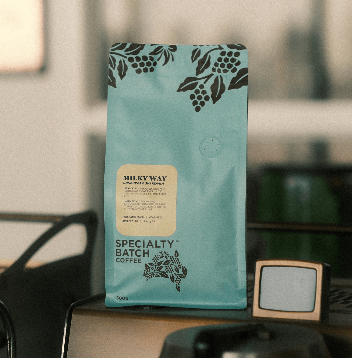 Milky Way Dark Roasted Premium Coffee Blend in Specialty Batch packaging on table