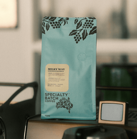 Milky Way Dark Roasted Premium Coffee Blend in Specialty Batch packaging on table