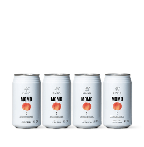Momo Sparkling Water cans with Japanese white peach flavor, showcasing elegant design and natural ingredients.