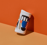 CREATED CO. City Scapes Nomad Flip 12 oz, featuring artwork by Cody Hudson, sleek white ceramic finish, leak-proof lid, and cup holder fit.