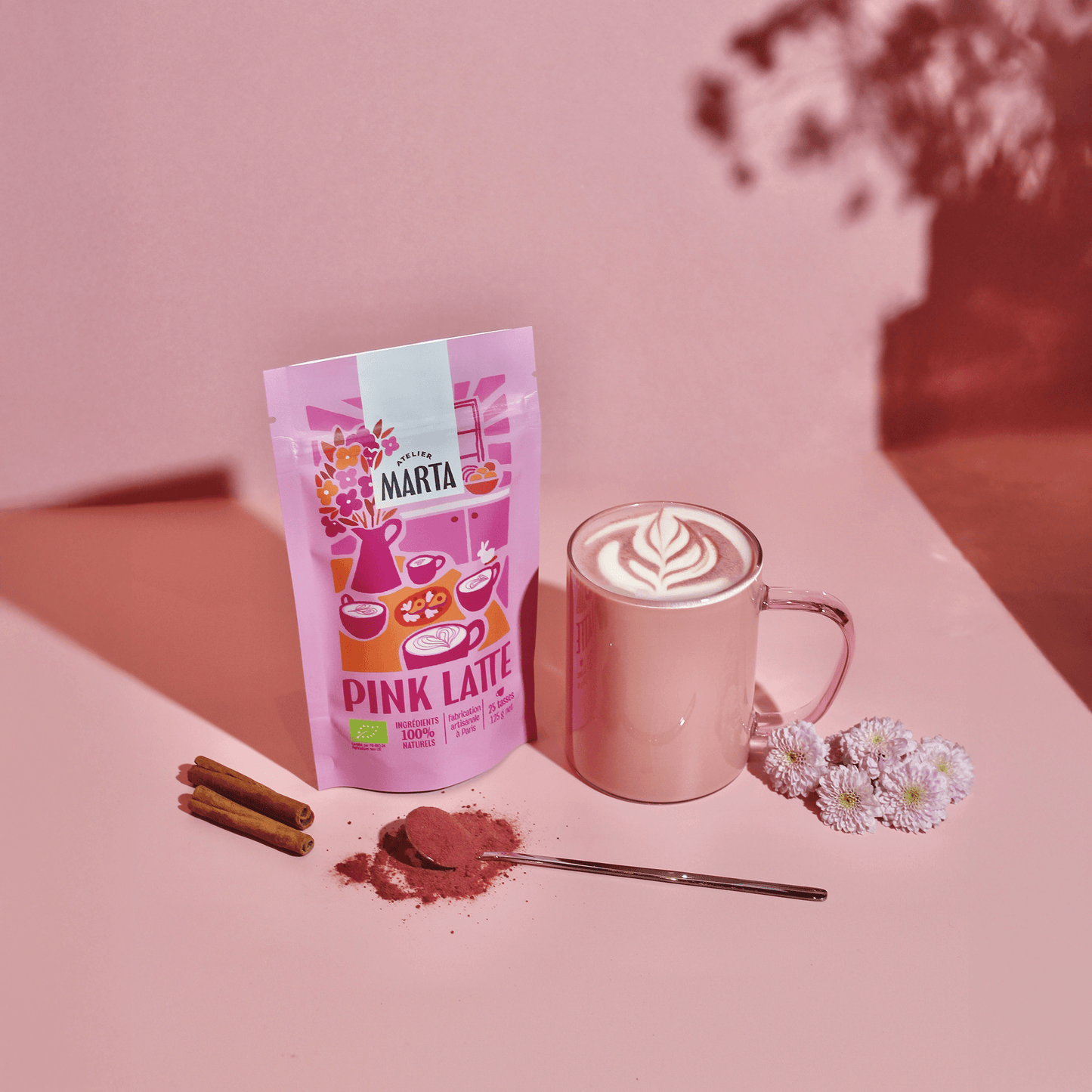 Product image of Organic Pink Latte by Atelier Marta featuring a pink chai latte and packaging.