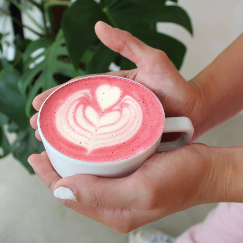 Pink Superfood Latte with acai and goji berries—fruity, tart, nutrient-rich, and a vibrant immune-boosting drink to lift your mood throughout the day.