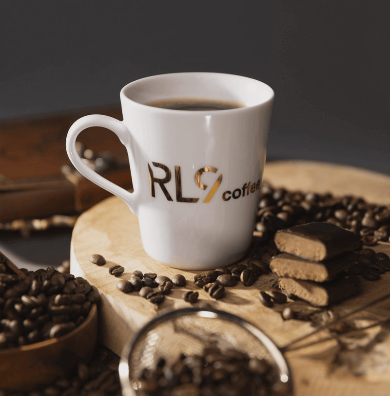 RL9 Coffee Espresso by Robert Lewandowski is a bold dark-roast blend of 100% Arabica beans, delivering thick crema and flavors of dark chocolate, cacao, walnuts, and tobacco.