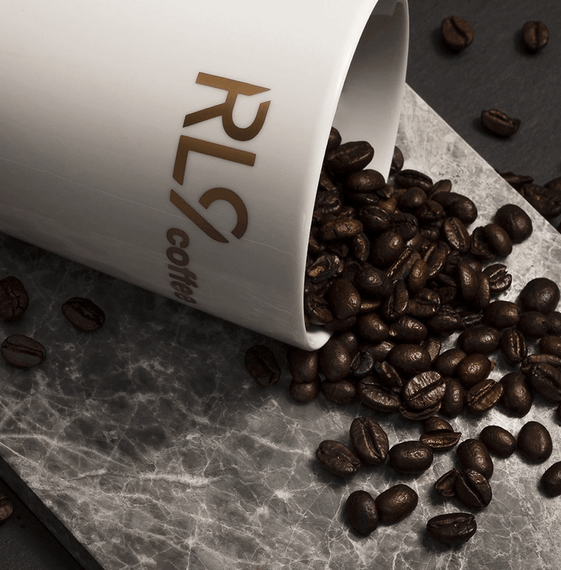 RL9 Coffee Espresso by Robert Lewandowski is a bold dark-roast blend of 100% Arabica beans, delivering thick crema and flavors of dark chocolate, cacao, walnuts, and tobacco.