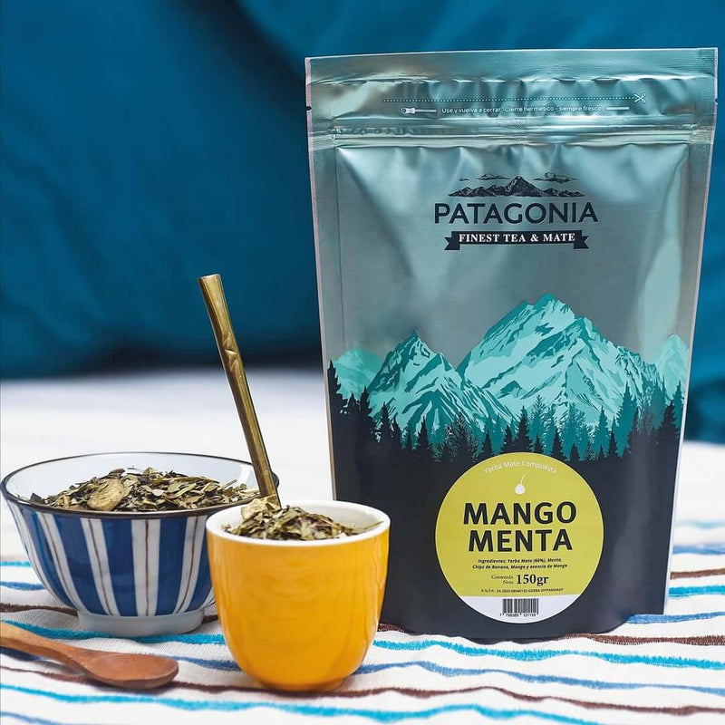 Menta Mango Yerba Mate packaging with two tea cups and a spoon, showcasing premium yerba mate from UAE Argentina.