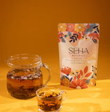 SEHA Wellness Flow-Tea with rose, saffron, and cardamom for hormonal balance and feminine health.